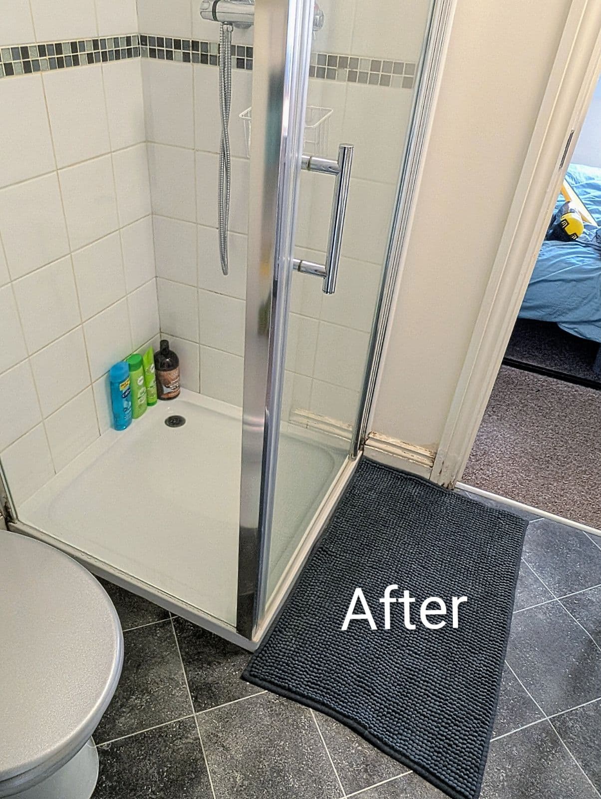 Shower enclosure gleaming with clear glass after cleaning